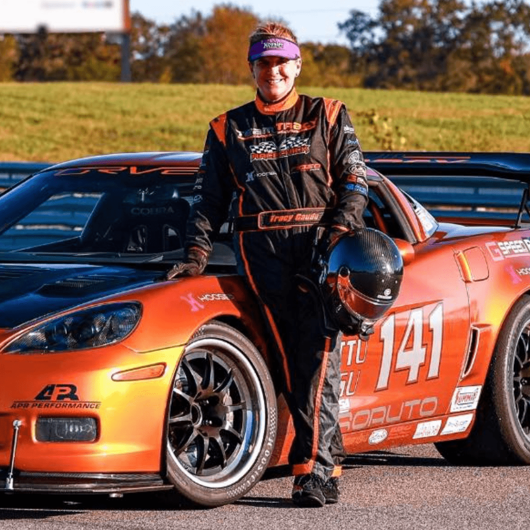 Race car driver with orange Corvette, 141