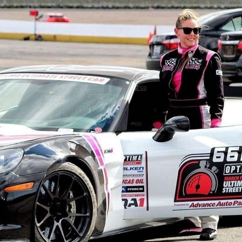 Race car driver with her street car