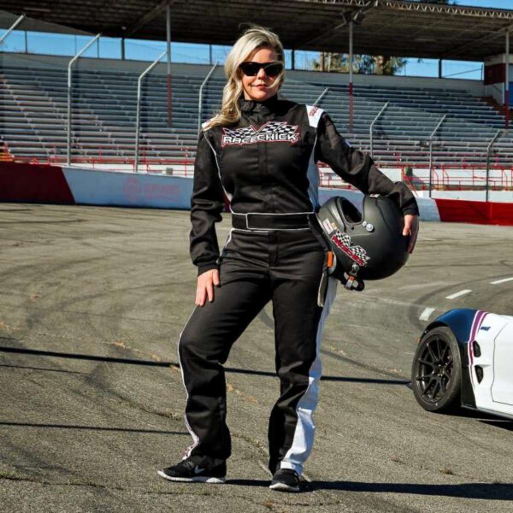 Woman wearing SFI 3.2A 5 Womens Auto Racing Suit. Black White Ladies Fire Suit